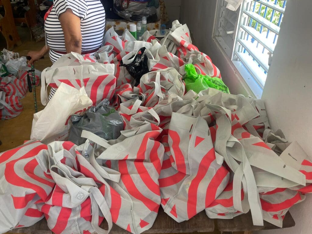 A pile of bags that are on the floor.